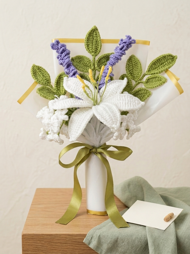 Crochet lily and lavender bouquet wrapped in paper with an olive ribbon