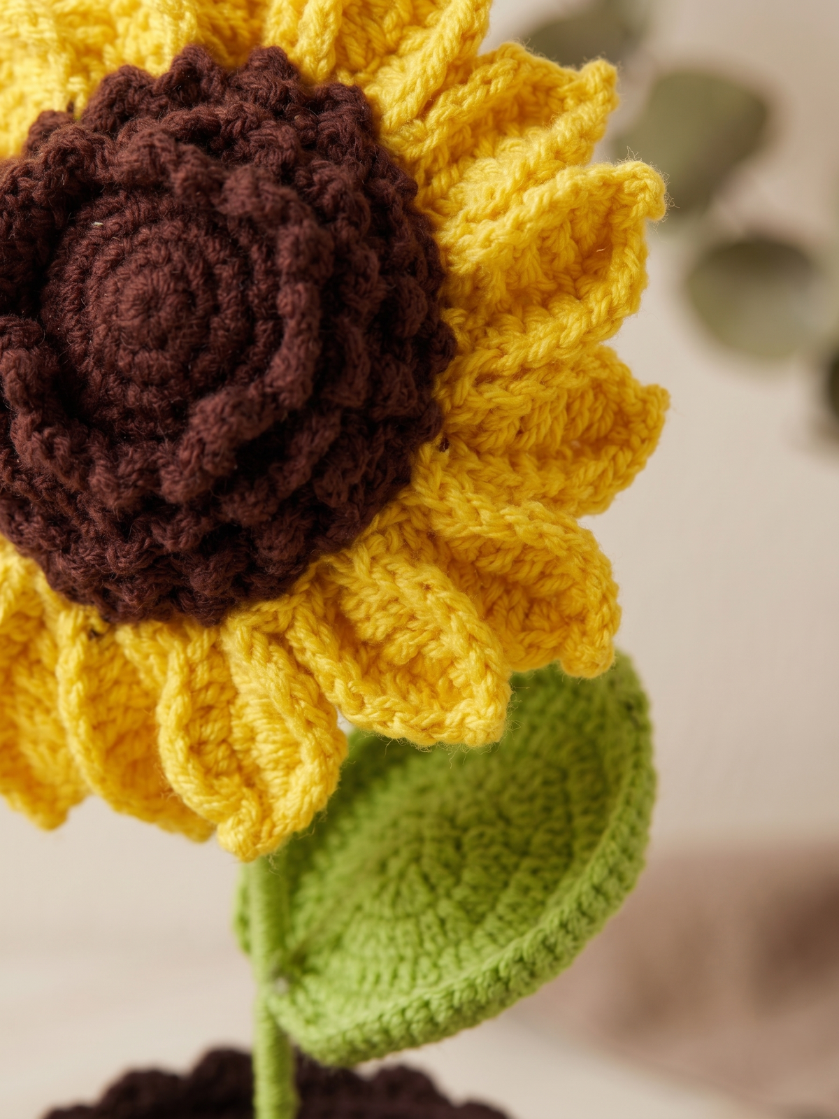 Close up of the crochet sunflower head and its stitched centre