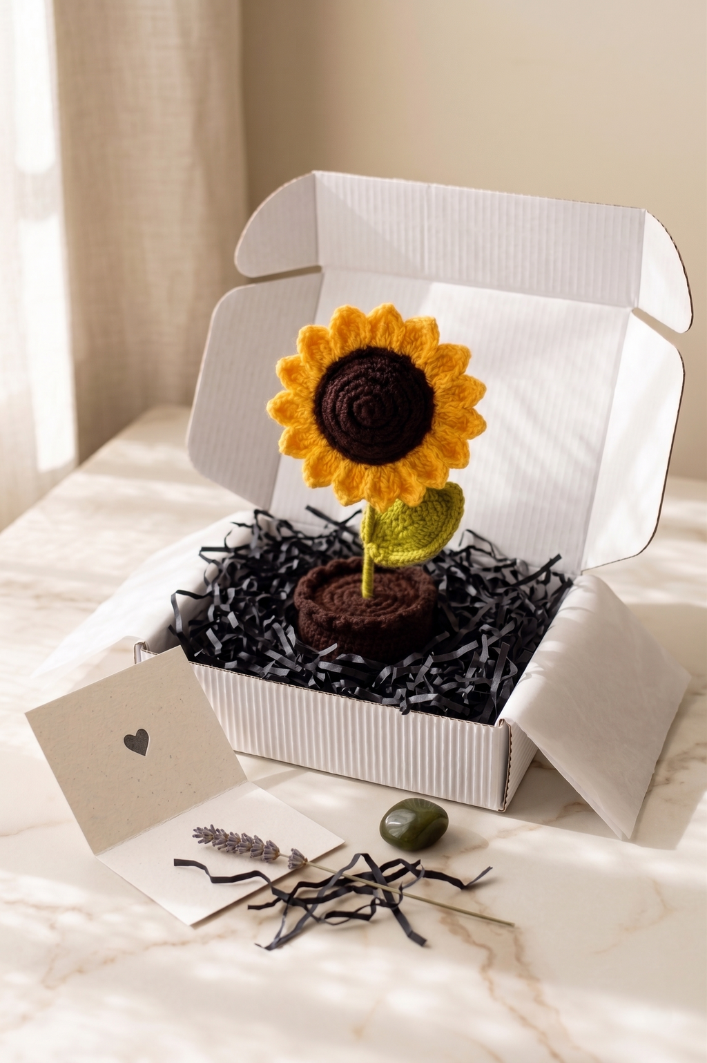 The sunflower pot gift-ready on a marble surface