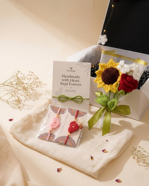 Everkept card reading Handmade with Heart, Kept Forever beside a pair of rakhis and the crochet sunflower bouquet